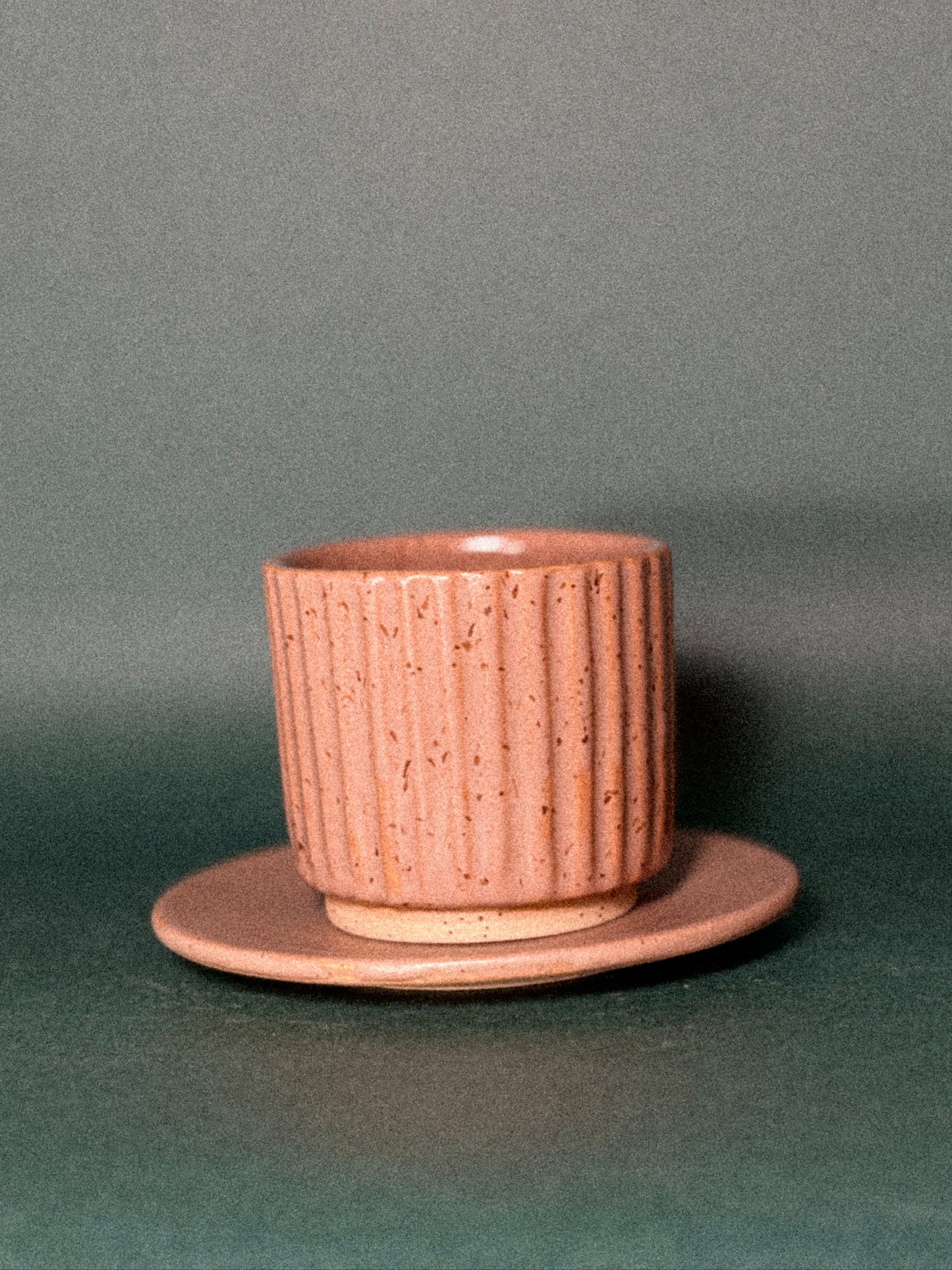 Textured cup with saucer