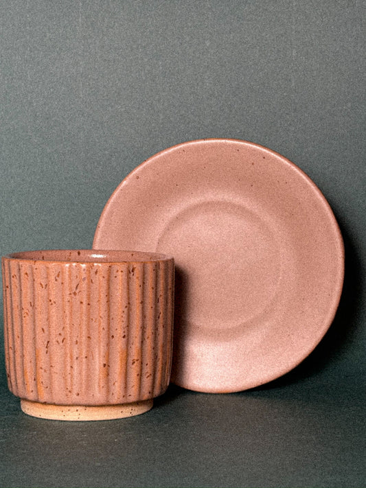 Textured cup with saucer